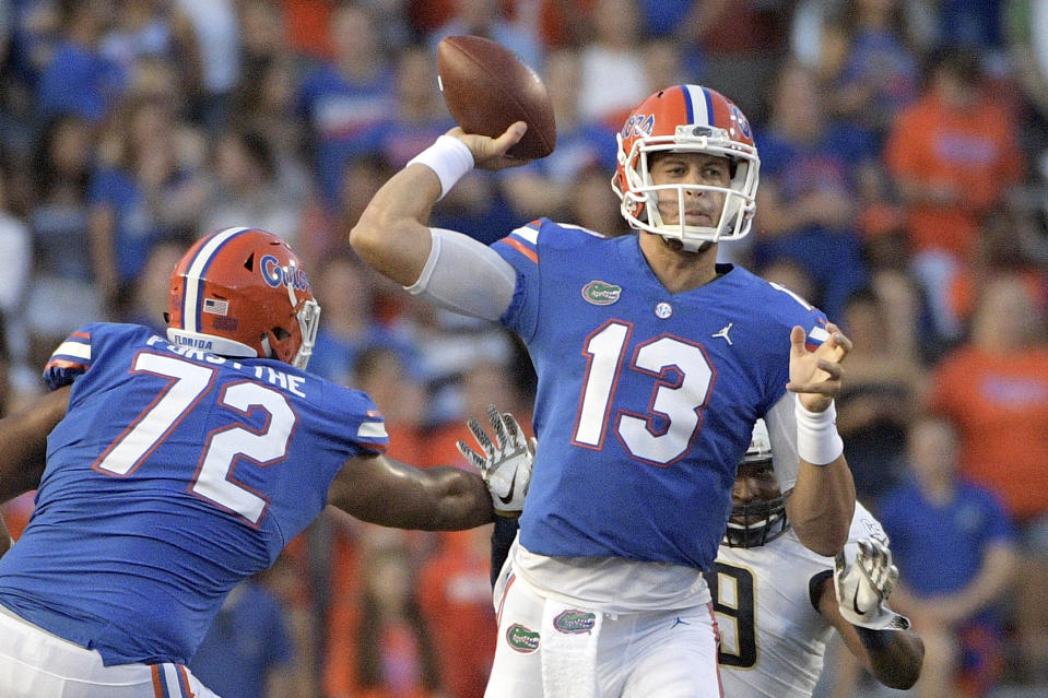 Florida quarterback Feleipe Franks (13) throws a pass as offensive lineman Stone Forsythe (72) blocks Charleston Southern defensive lineman Jonathan Glover II during the first half of an NCAA college football game, Saturday, Sept. 1, 2018, in Gainesville, Fla. (AP Photo/Phelan M. Ebenhack)