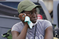 Linda Smoot, who evacuated from Hurricane Laura in a pickup truck with eight others, reacts as she returns to see her niece's damaged home, in Lake Charles, La., in the aftermath of the hurricane, Sunday, Aug. 30, 2020. (AP Photo/Gerald Herbert)