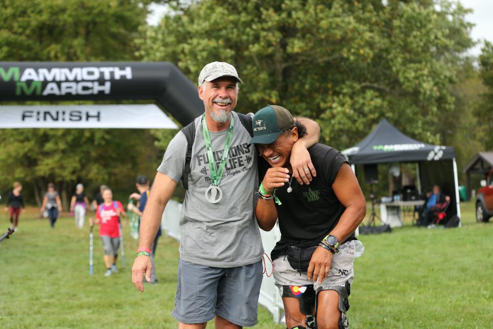 MammothMarch participants celebrate crossing the finish line at a past event.