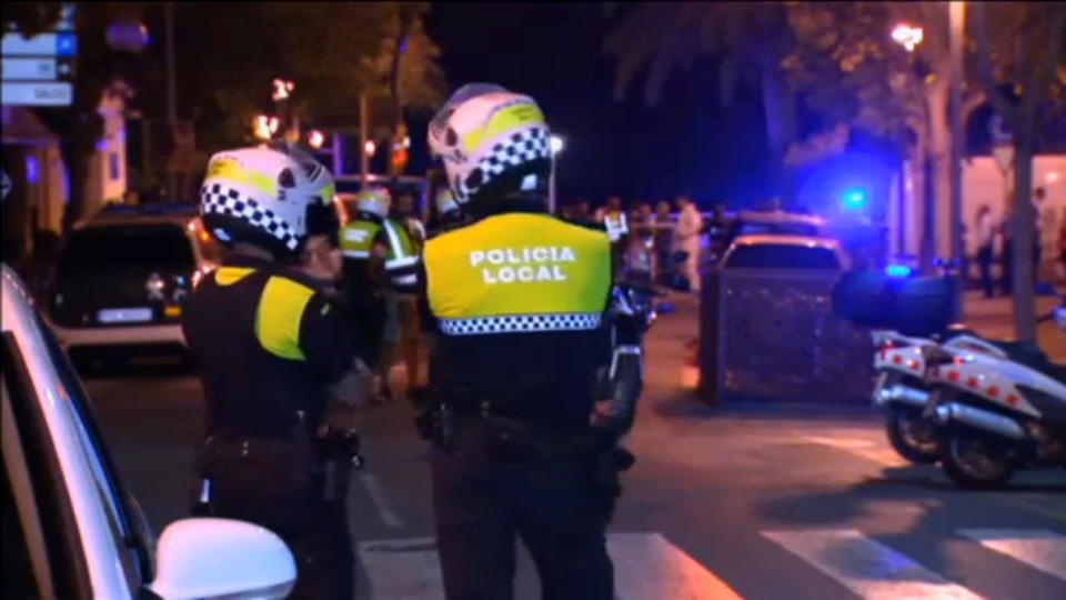 Officers investigate at the scene where police had killed five attackers in Cambrils, south of Barcelona. (Still image from Reuters video)