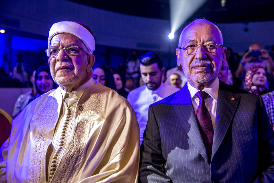 Vice President of the Islamist party Ennahda and candidate for the upcoming presidential elections Abdelfattah Mourou, left, and Tunisian Leader of the Islamist Ennahda party, Rachid Ghannouchi during a meeting with the members of the party in Tunis, Tunisia, Friday, Aug. 30, 2019. (AP Photo/Hassene Dridi)