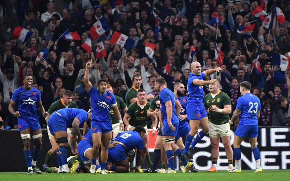The French players celebrate the hard-fought win over the impressive Springboks - Sylvain Thomas /AFP
