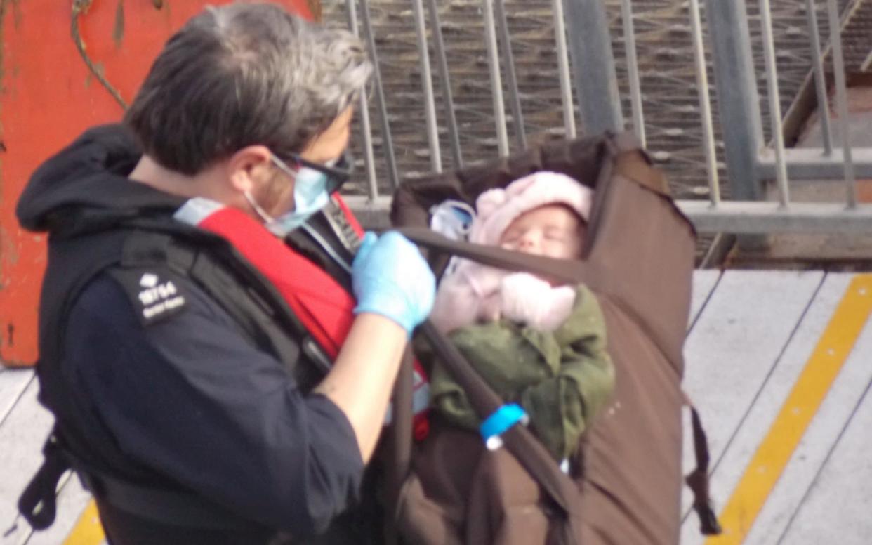 A tiny baby was among those who arrived in Dover yesterday after crossing the channel on a dinghy - Steve Laws/SWNS