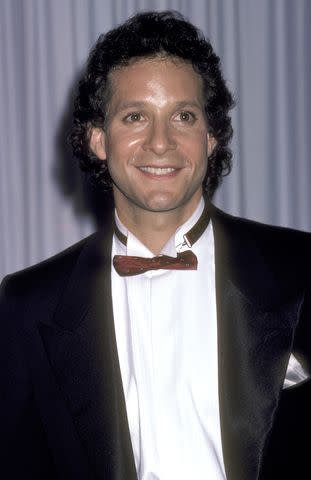 <p>Ron Galella, Ltd./Ron Galella Collection via Getty</p> Steve Guttenberg at the Oscars in 1986