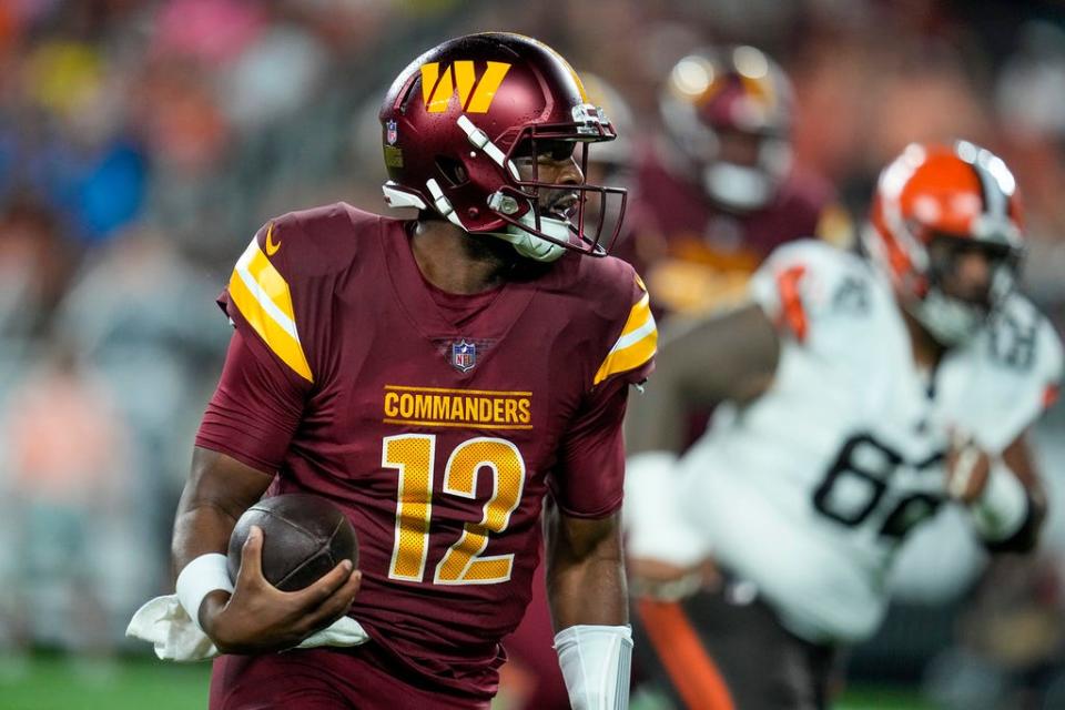 Washington Commanders quarterback Jacoby Brissett runs against the Cleveland Browns during a preseason game on Aug. 11 in Cleveland.