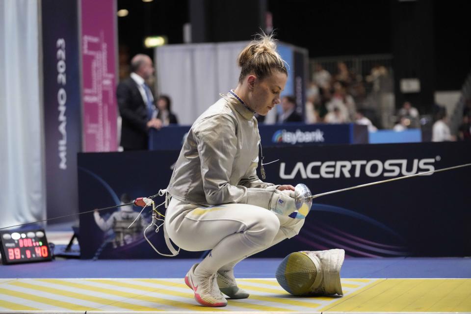 FILE - UKraine's Olga Kharlan concentrates before competing against U.S. Elizabeth Tartakovsky during the women's Team Sabre eight finals, at the Fencing World Championships in Milan, Italy, Sunday, July 30, 2023. (AP Photo/Luca Bruno, File)