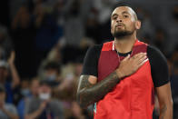 Nick Kyrgios of Australia reacts after defeating Liam Broady of Britain in their first round match at the Australian Open tennis championships in Melbourne, Australia, Tuesday, Jan. 18, 2022. (AP Photo/Andy Brownbill)