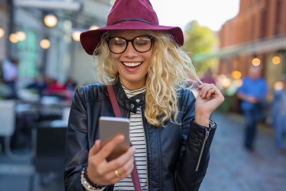 Woman looking at her cellphone.