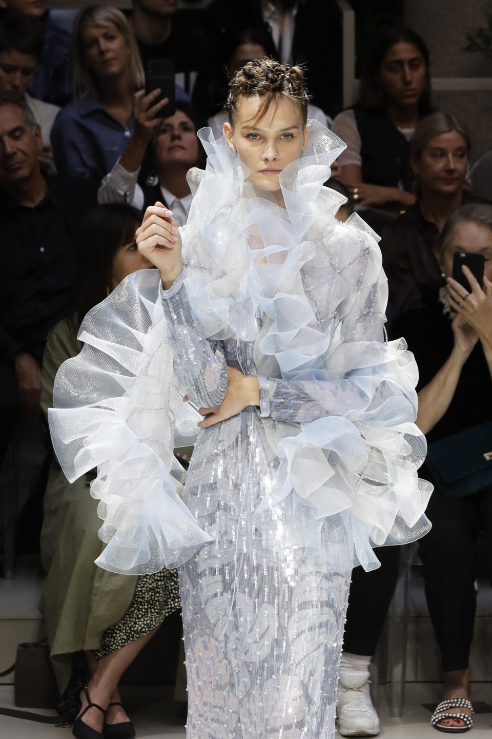 A model wears a creation as part of the Armani Spring-Summer 2020 collection, unveiled during the fashion week, in Milan, Italy, Saturday, Sept. 21, 2019. (AP Photo/Luca Bruno)