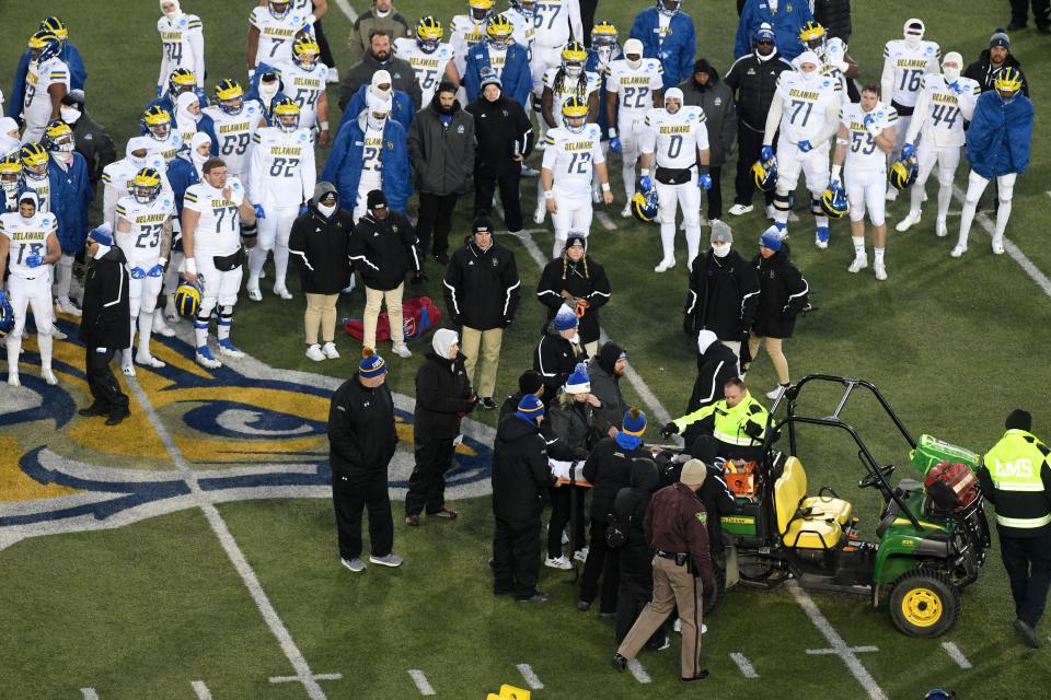 Delaware quarterback Ryan O’Connor is loaded on a stretcher to be transported off the field for emergency care after a severe injury with only a minute left in the FCS playoff game against South Dakota State on December 3, 2022, at Dana J. Dykhouse Stadium in Brookings. The game ended immediately after.