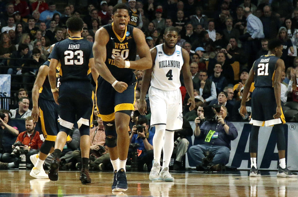 West Virginia’s Sagaba Konate celebrates a made basket against Villanova during the second half of an NCAA men’s college basketball tournament regional semifinal Friday, March 23, 2018, in Boston. (AP Photo/Mary Schwalm)