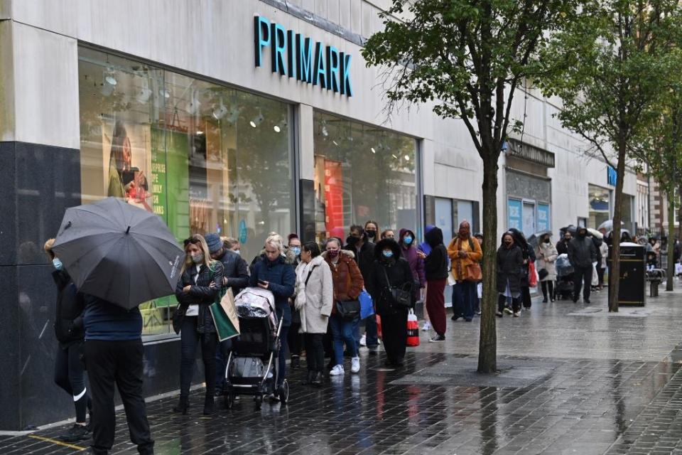 Shoppers queue outside a Primark store in Liverpool before lockdownAFP via Getty