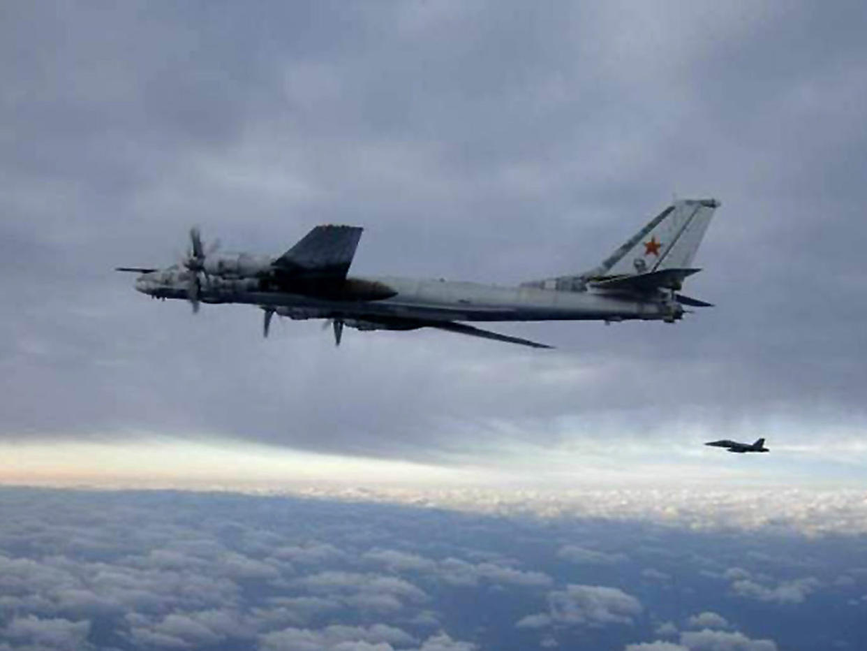 An F/A-18 Hornet escorts a Russian Tu-95 Bear bomber aircraft in February 2008 south of Japan: AFP/Getty