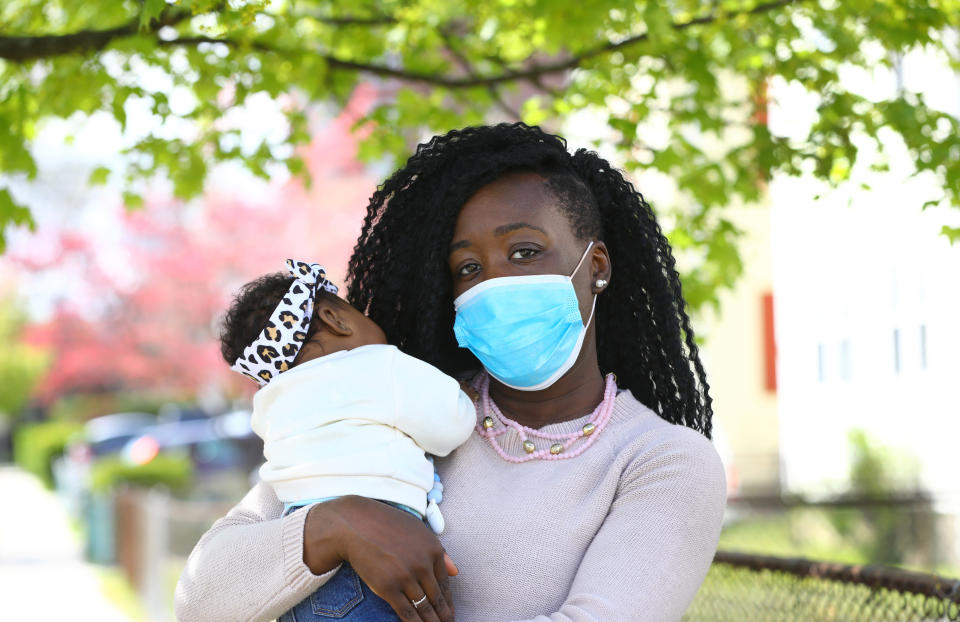 New mother Alice Owolabi Mitchell is photographed with her 10-week-old daughter Everly Owolabi Mitchell in Quincy, MA on May 6, 2020. (Photo by Pat Greenhouse/The Boston Globe via Getty Images)