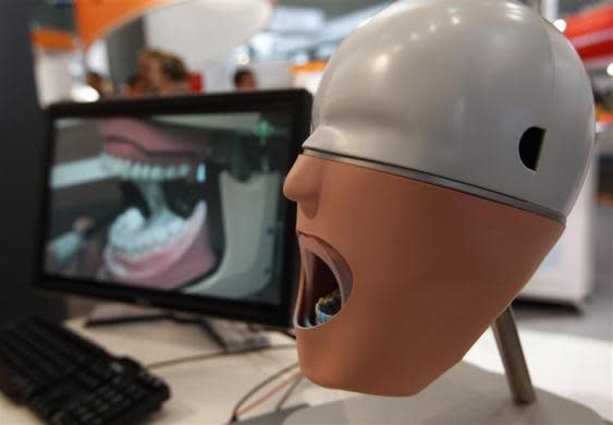 A setup for a digital impression for a denture is pictured at the Hanover industrial fair in Hanover, April 23, 2012.