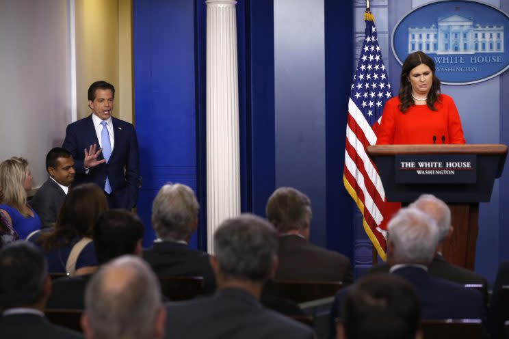 Sarah Huckabee Sanders, flanked by new White House communications director Anthony Scaramucci, holds the daily briefing at the White House in Washington.