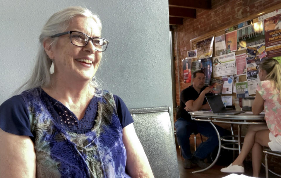 Kathleen Evenhouse, of Pella, Iowa, speaks during an interview with the Associated Press in a coffee shop in Pella, Iowa, on Thursday, June 15, 2023. Evenhouse discussed what she views as a politically motivated Justice Department, in light of former President Donald Trump’s indictment. “I think we’re playing a game as a country,” the 72-year-old author said. (AP Photo/Thomas Beaumont)