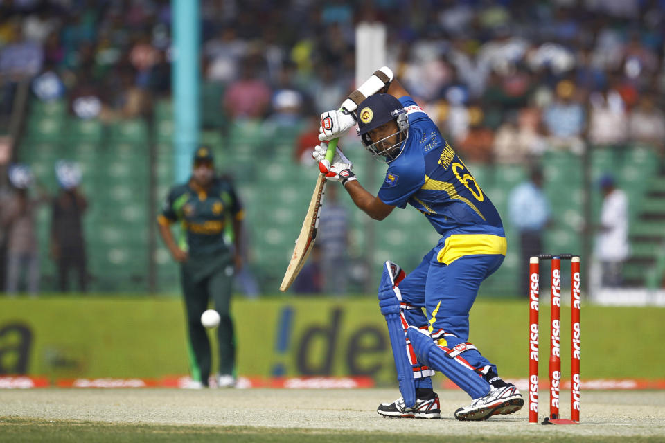 Sri Lanka’s Lahiru Thirimanne plays a shot against Pakistan during their opening match of the Asia Cup one-day international cricket tournament in Fatullah, near Dhaka, Bangladesh, Tuesday, Feb. 25, 2014. (AP Photo/A.M. Ahad)