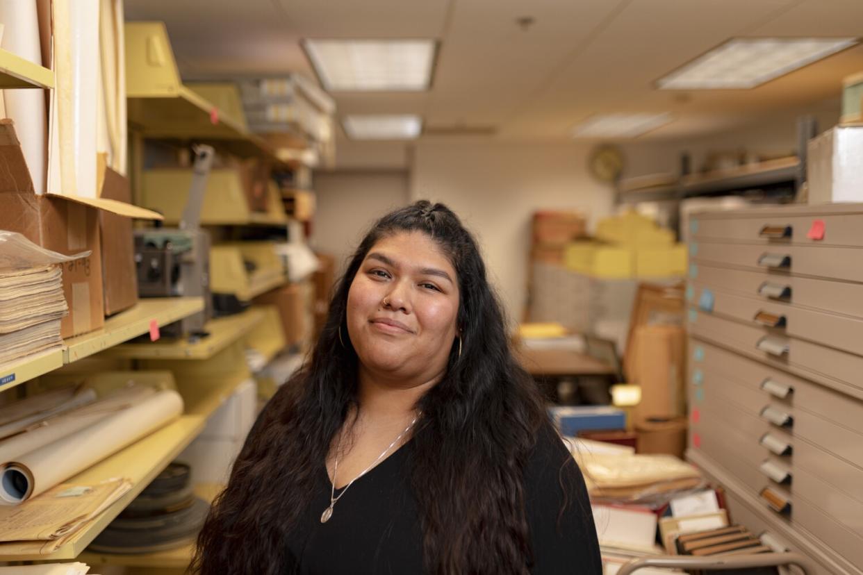 Veronica Mendiola inside a library's archival multimedia collection room