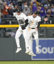 From left to right, Colorado Rockies left fielder Jordan Beck, center fielder Brenton Doyle and right fielder Jake Cave celebrate after a baseball game against the Texas Rangers Friday, May 10, 2024, in Denver. (AP Photo/David Zalubowski)