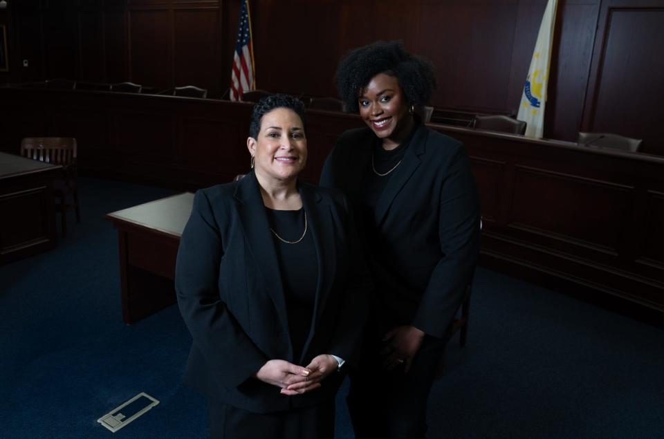 Roger Williams University Law Dean Lorraine Lalli, left, with first-year student Ruth Dimanche in a mock courtroom at the RWU School of Law.