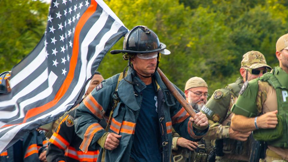 A firefighter runs one mile during a memorial for Austin Duran, an Apopka firefighter who died after being crushed at his fire station on June 30, 2022.