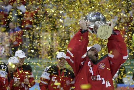 Canada's goaltender Mike Smith holds the trophy during the victory ceremony of the Ice Hockey World Championship final game at the O2 arena in Prague, Czech Republic May 17, 2015. REUTERS/David W Cerny