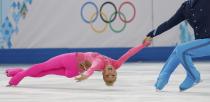 Germany's Aliona Savchenko and Robin Szolkowy compete during the Figure Skating Pairs Short Program at the Sochi 2014 Winter Olympics, February 11, 2014. REUTERS/Alexander Demianchuk (RUSSIA - Tags: OLYMPICS SPORT FIGURE SKATING)