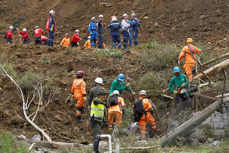 Rescuers search for survivors or victims of a landslide that affected the Medellin-Bogota highway in Colombia October 26, 2016. REUTERS/Fredy Builes