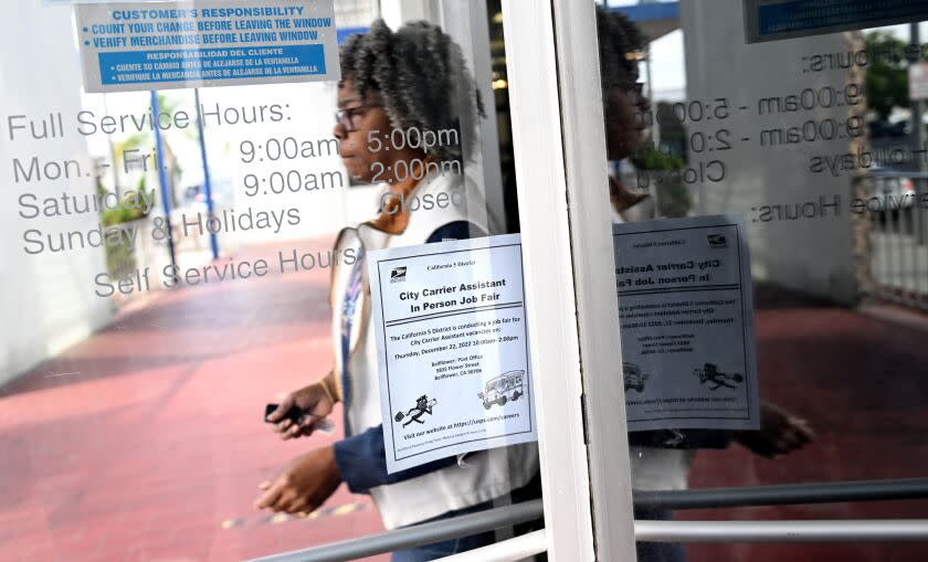 Bellflower, California December 22, 2022-A sign for a job fair hangs on the door in Bellflower Thursday in hopes of finding employment as the USPS is hiring twenty thousand new postal workers. (Wally Skalij/Los Angeles Times)