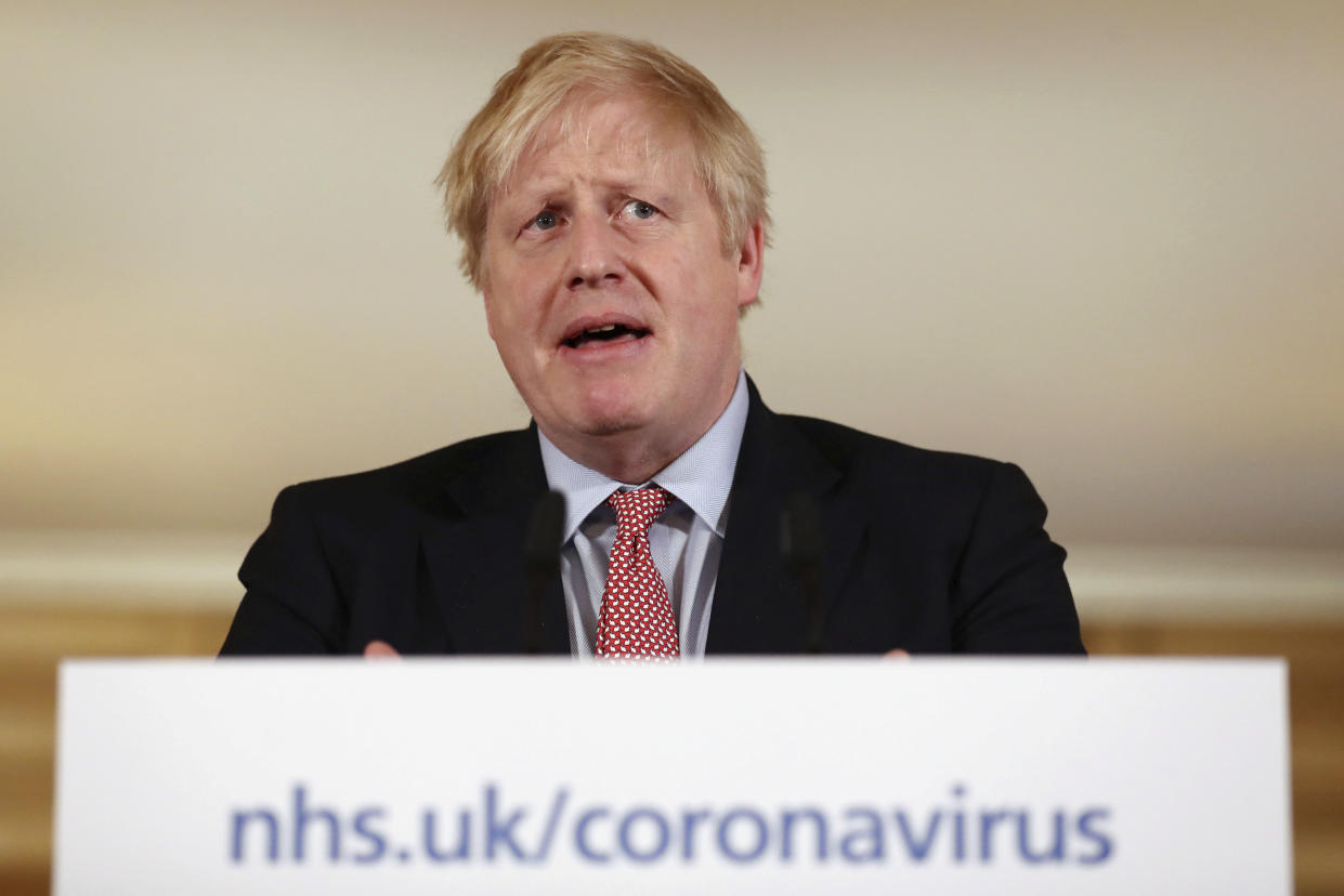 Britain's Prime Minister Boris Johnson holds a news conference to give the government's response to the new COVID-19 coronavirus outbreak, at Downing Street in London, Thursday March 12, 2020. For most people, the new COVID-19 coronavirus can cause only mild or moderate symptoms, but for some it can cause more severe illness. (Simon Dawson/Pool via AP)