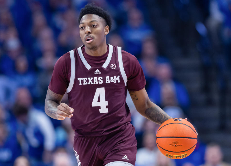 LEXINGTON, KY - JANUARY 21: Wade Taylor IV #4 of the Texas A&M Aggies dribbles during the game against the Kentucky Wildcats at Rupp Arena on January 21, 2023 in Lexington, Kentucky. (Photo by Michael Hickey/Getty Images)