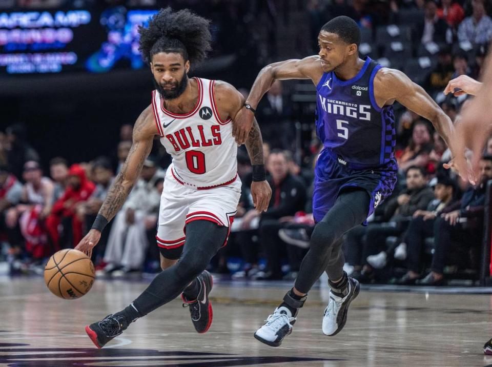 Chicago Bulls guard Coby White (0) drives to the basket against Sacramento Kings guard De’Aaron Fox (5) during an NBA game on Monday, March 4, 2024 at Golden 1 Center. White scored a game high 37 points.