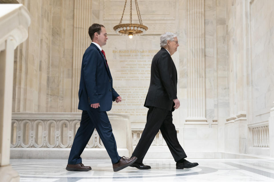 Senate Minority Leader Mitch McConnell of Ky., right, walks with a staffer, Tuesday, May 18, 2021, to a meeting with Senate Republicans on Capitol Hill in Washington. (AP Photo/Jacquelyn Martin)