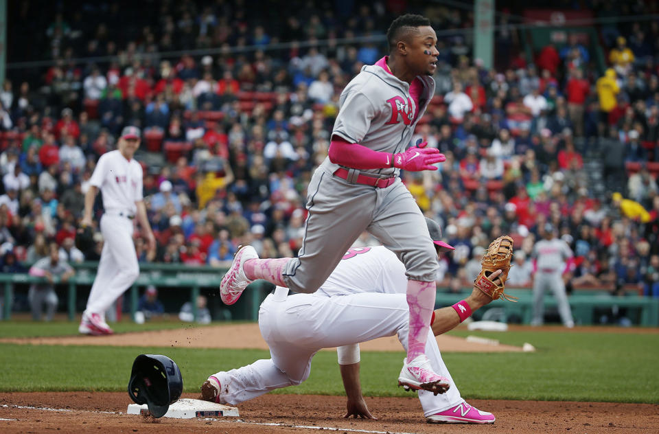 <p>Tampa Bay Rays’ Tim Beckham, center, can not beat the throw to Boston Red Sox’s Mitch Moreland, behind, on a ground out in the fifth inning of a baseball game, May 13, 2017, in Boston. (Photo: Michael Dwyer/AP) </p>