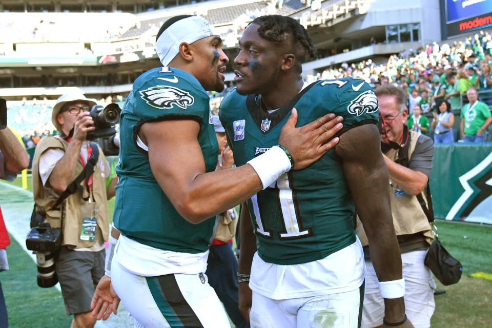 Oct 1, 2023; Philadelphia, Pennsylvania, USA; Philadelphia Eagles quarterback Jalen Hurts (1) and wide receiver A.J. Brown (11) celebrate win against the Washington Commanders at Lincoln Financial Field. Mandatory Credit: Eric Hartline-USA TODAY Sports