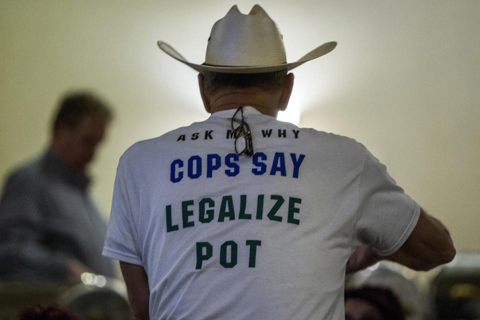 Retired Bath Township Police Det. Howard "Cowboy" Wooldrige waits for election results to come in for Proposal 18-1 during the Coalition to Regulate Marijuana Like Alcohol public watch party at The Radisson in Lansing, Mich., on Tuesday, Nov. 6, 2018. (Cory Morse/The Grand Rapids Press via AP)