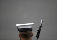 A serviceman stands with a rifle with a bayonet at the ceremony to mark the 100th anniversary of the start of the Gallipoli campaign, at the Cenotaph on Whitehall in London, April 25, 2015. (REUTERS/Peter Nicholls)