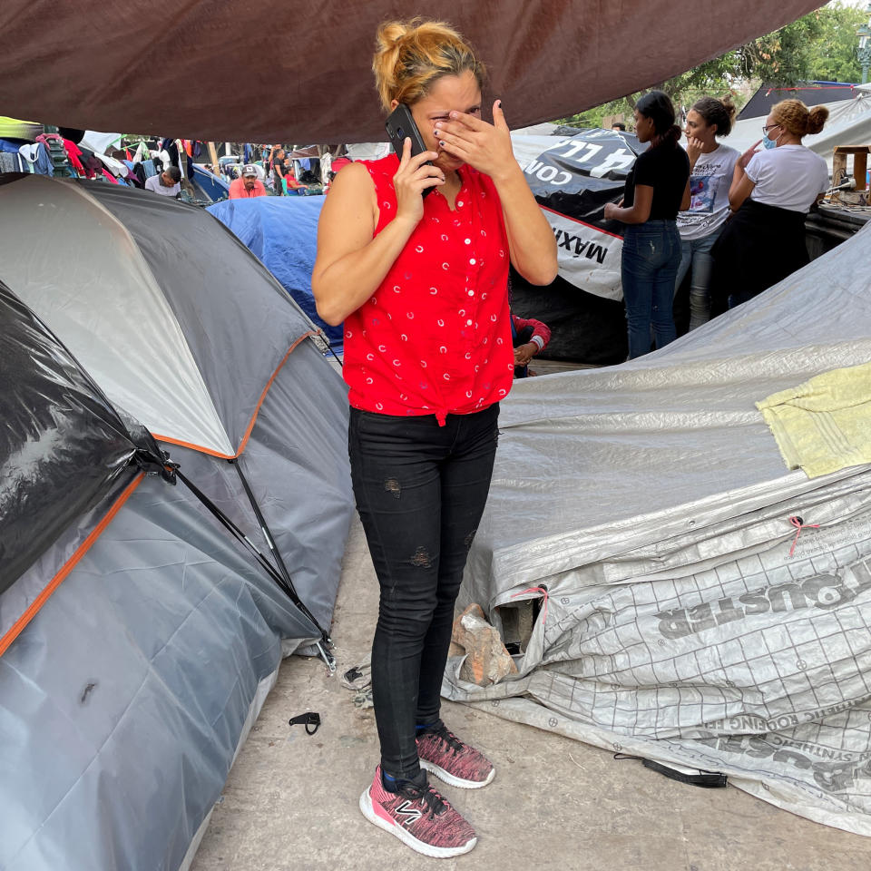 A sobbing Carolina calls her family in Honduras moments after being deported to Reynosa with her 12-year-old daughter, Genesis.

 (Erika Angulo / NBC News)