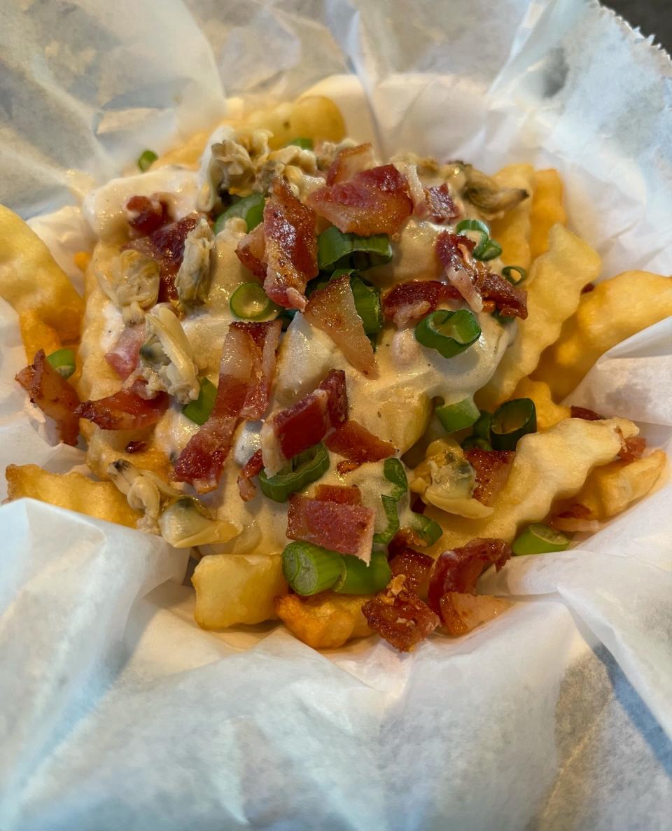 Clam Chowder Fries are one of the new foods at the 2022 Wisconsin State Fair. It's fries topped with clam chowder, bacon and chopped green onions. It will be located at Gooonies Fish & Beer Shack.