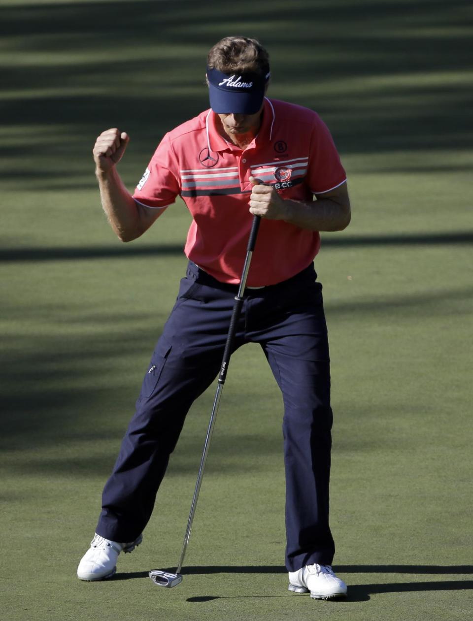 Bernhard Langer, of Germany, pumps his fist after a birdie on the 15th hole during the first round of the Masters golf tournament Thursday, April 10, 2014, in Augusta, Ga. (AP Photo/David J. Phillip)