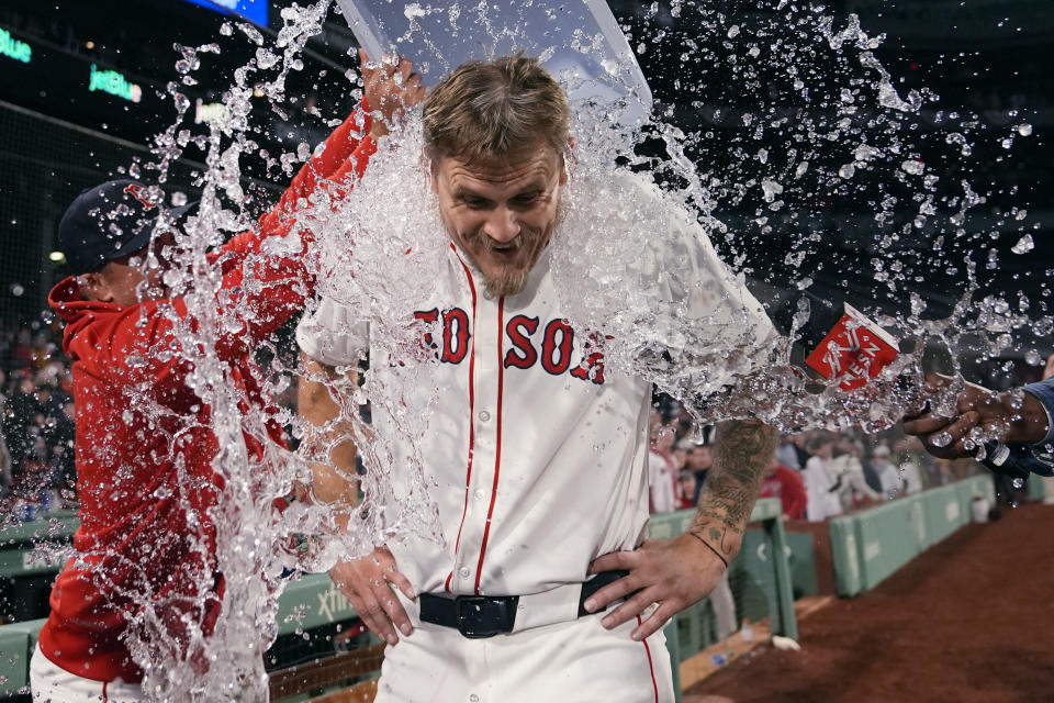 Boston Red Sox pitcher Tanner Houck is doused after throwing a three-hitter against the Cleveland Guardians in a baseball game Wednesday, April 17, 2024, in Boston. The Red Sox won 2-0. (AP Photo/Charles Krupa)