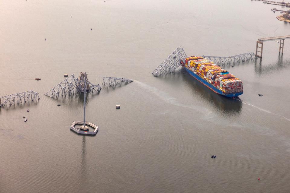 In an aerial view, cargo ship Dali is seen after running into and collapsing the Francis Scott Key Bridge on March 26, 2024 in Baltimore.