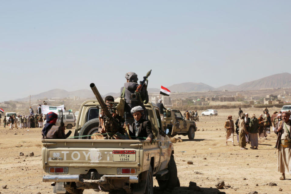 Houthi followers ride vehicles with artillery during a tribal gathering on Jan. 14, 2024, on the outskirts of Sana'a, Yemen.  / Credit: Mohammed Hamoud/Getty Images