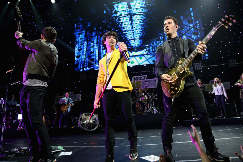 LOS ANGELES, CA - DECEMBER 01:  (L-R) Musicians Nick Jonas, Joe Jonas, and Kevin Jonas of The Jonas Brothers perform onstage during KIIS FM's 2012 Jingle Ball at Nokia Theatre L.A. Live on December 1, 2012 in Los Angeles, California.  (Photo by Christopher Polk/Getty Images for Clear Channel)