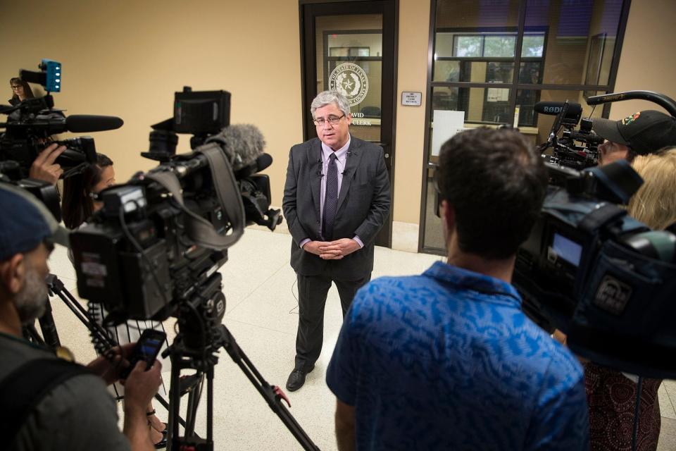 Appeals attorney Keith Hampton answers questions Nov. 6, 2019, from reporters at the Williamson County Justice Center about Greg Kelley's exoneration. Kelley was accused in 2013 of sexually assaulting two 4-year-old boys at an in-home daycare site operated by a friend's family in Cedar Park. [RICARDO B. BRAZZIELL/AMERICAN-STATESMAN]