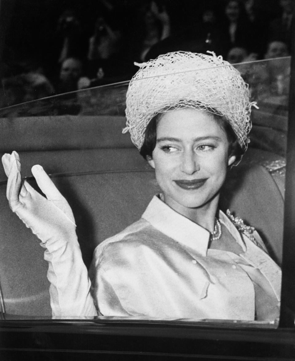The Queen's sister Princess Margaret waves from a car in the 1950s.