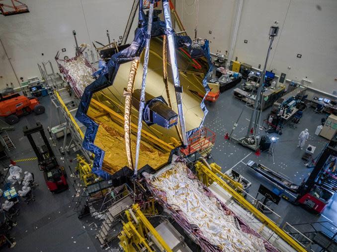 The James Webb Space Telescope, with its huge sunshield folded, during processing at a Northrop Grumman facility in Redondo Beach, Calif. / Credit: NASA