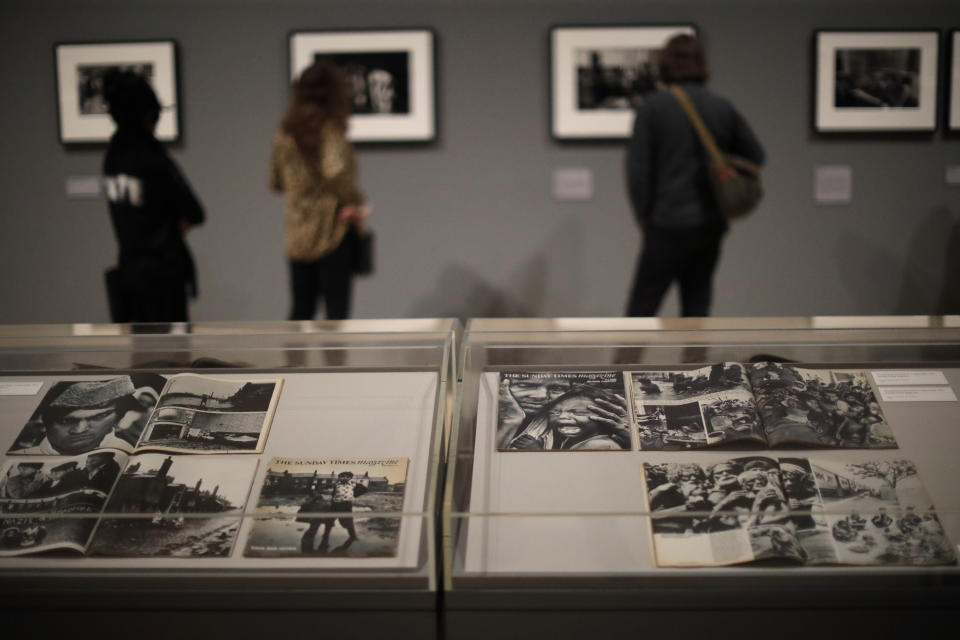 Sunday Times Magazine photo essays by veteran British conflict photographer Don McCullin are displayed at the launch of his retrospective exhibition at the Tate Britain gallery in London, Monday, Feb. 4, 2019. The exhibition includes over 250 of his black and white photographs, including conflict images from the Vietnam war, Northern Ireland, Cyprus, Lebanon and Biafra, alongside landscape and still life images. (AP Photo/Matt Dunham)