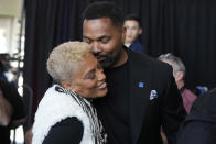 Newly-named New England Patriots head coach Jerod Mayo greets his mother Denise after facing reporters Wednesday, Jan. 17, 2024, during an NFL football news conference, in Foxborough, Mass. Mayo succeeds Bill Belichick as the franchise's 15th head coach. (AP Photo/Steven Senne)